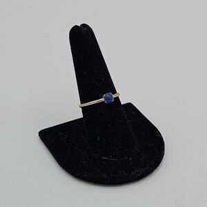 gold tone stackable ring with blue accent size 7.75
